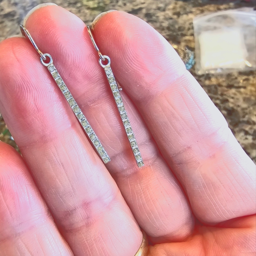 Sterling silver and diamond dangle earrings. Lightweight fashion simple classic
